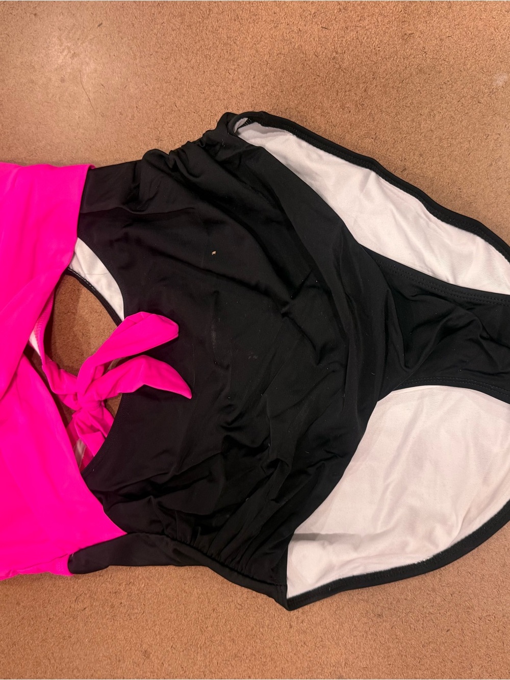 Sleek Black and Hot Pink One-Piece Swimsuit with Tie Detail